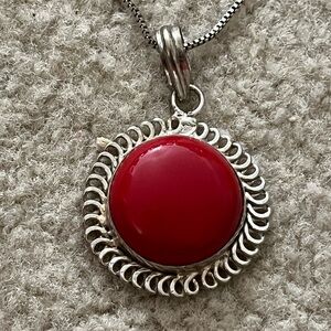 Sterling silver necklace with large red pendent.